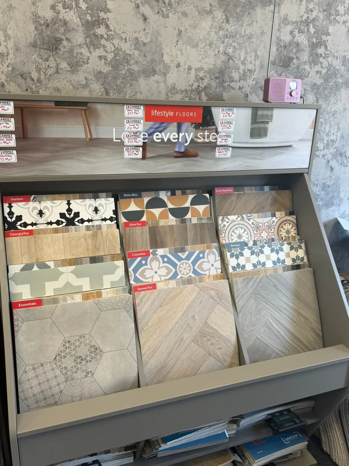 Patterned and wood-effect vinyl samples on display